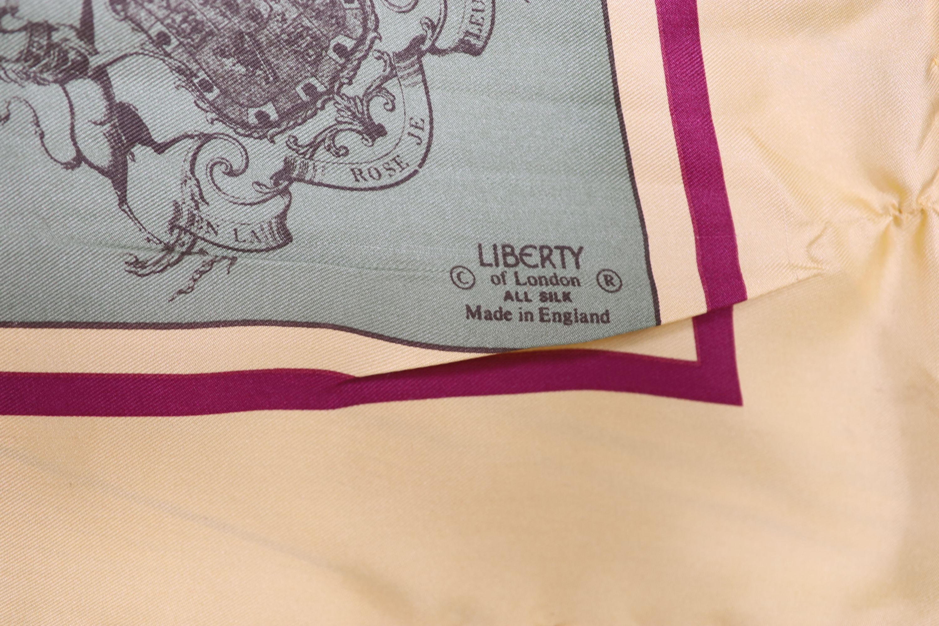 A Liberty silk scarf with a printed horse racing scene, with slip case